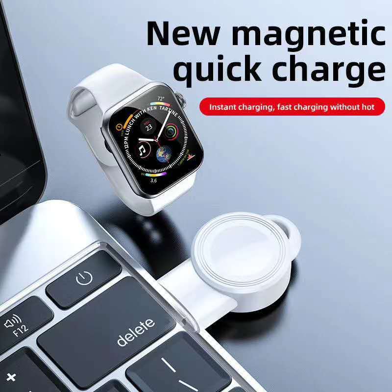 A close-up of a USB wireless charging pad with a smartphone placed on top, charging.