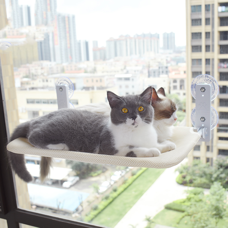 Cozy cat suction cup hammock made from plush fabric and steel, with breathable mesh.