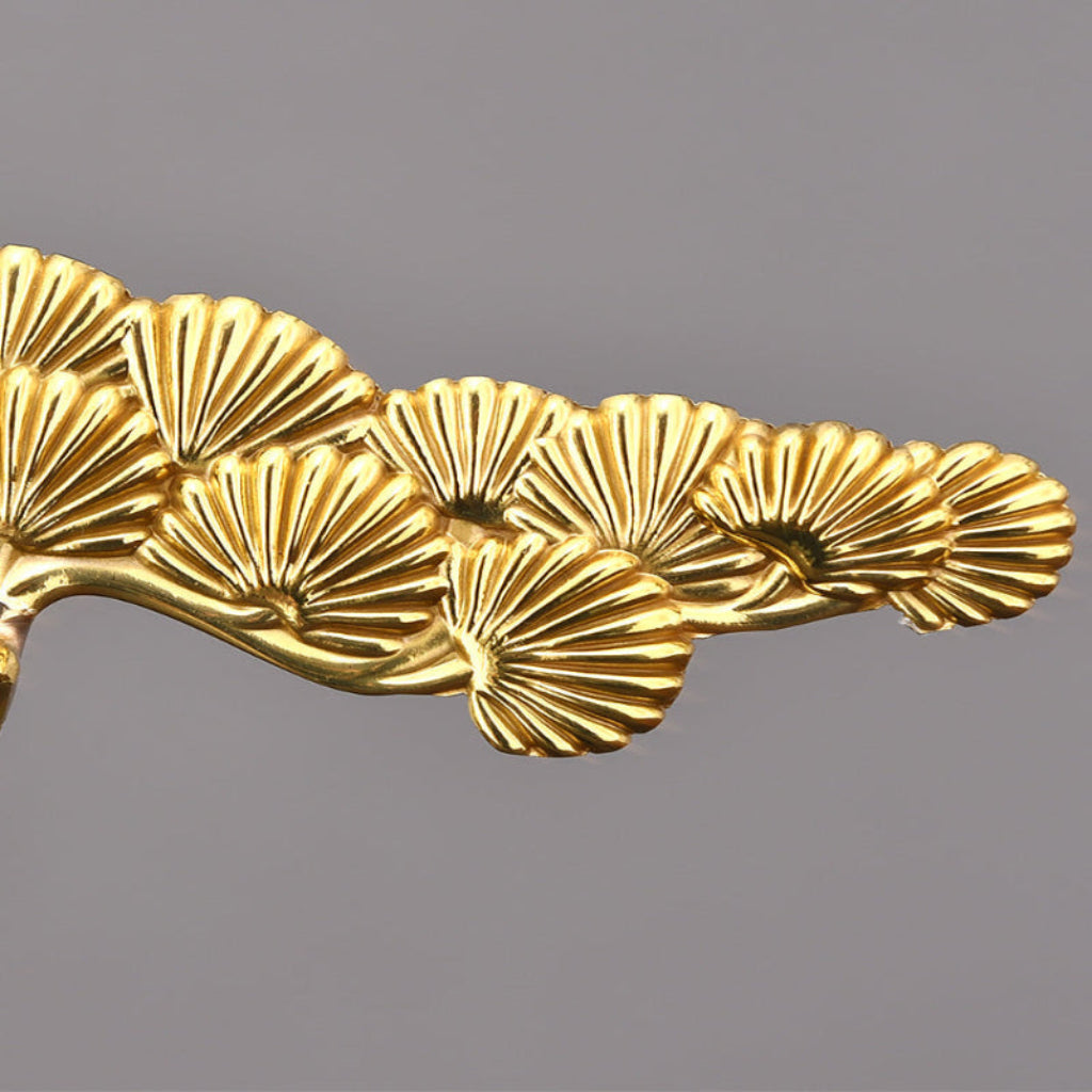 Modern and minimalistic brass plant decoration for your living room, with multiple base options.