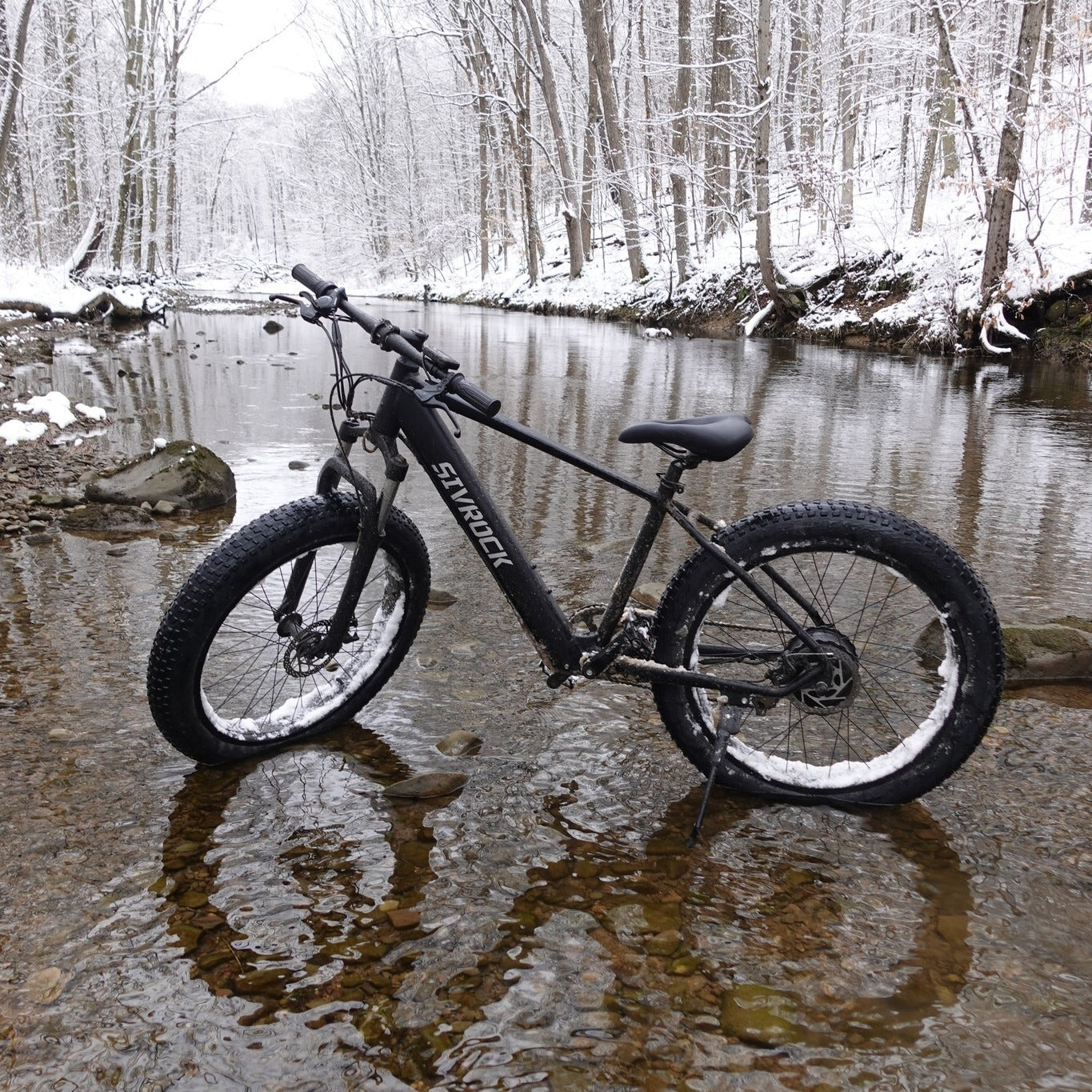 Sivrock bike's aluminum frame and front suspension, emphasizing its durability.