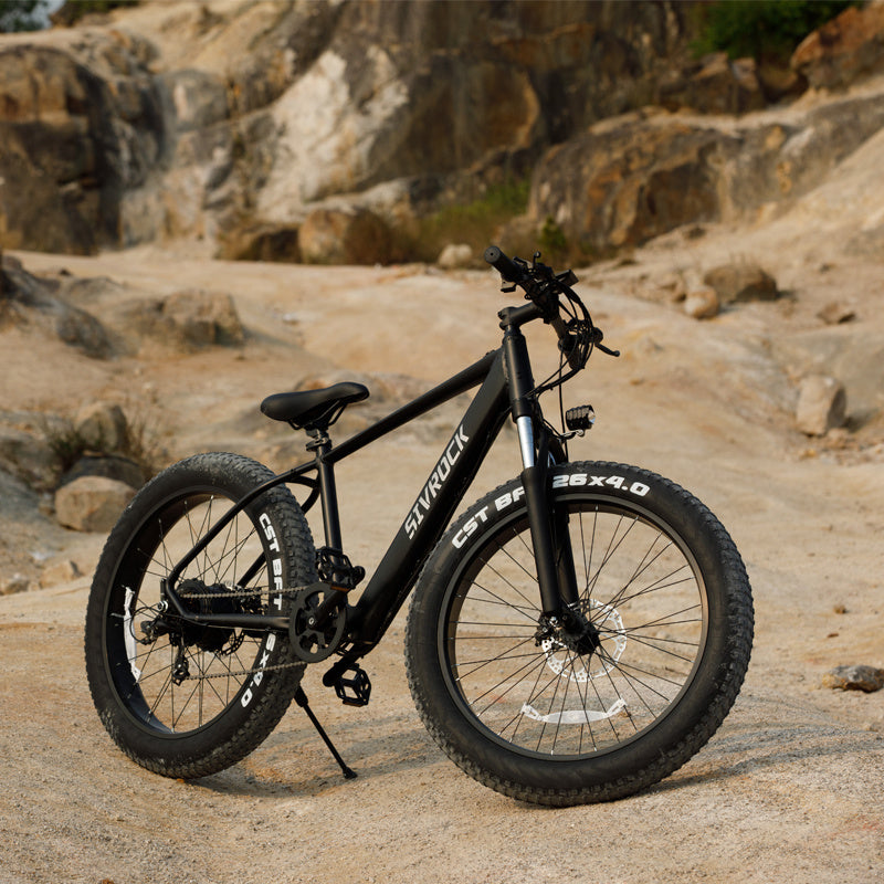 Sivrock bike's 26-inch wheels with 4.0-inch wide tires, showing its size.