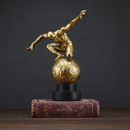 Elegant gold synthetic resin ornament, perfect for enhancing any home decor.