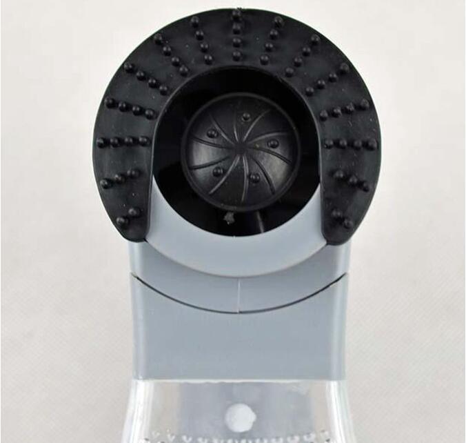 Person using a pet hair remover on a couch.